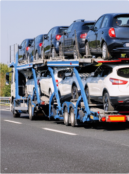 A flatbed truck hauling heavy materials, representing hauling activities.